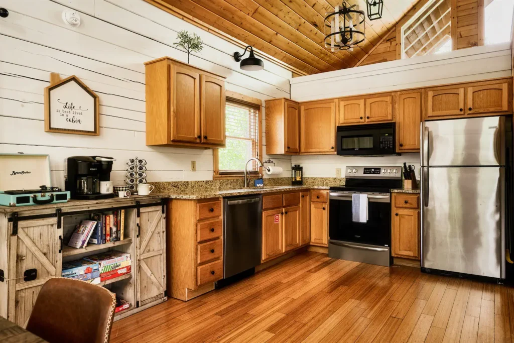 Rustic cabin kitchen with wooden cabinets and modern appliances